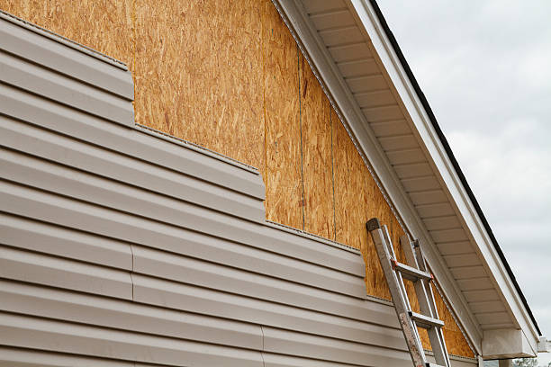 Professional Siding technician working in Fort Hill, PA